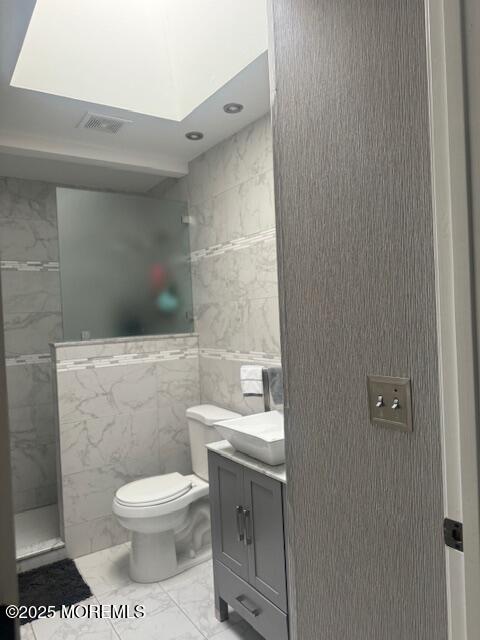 4 Coral Drive Howell, NJ 07731 - Photo 35 of 47 a bathroom with a toilet a sink and mirror