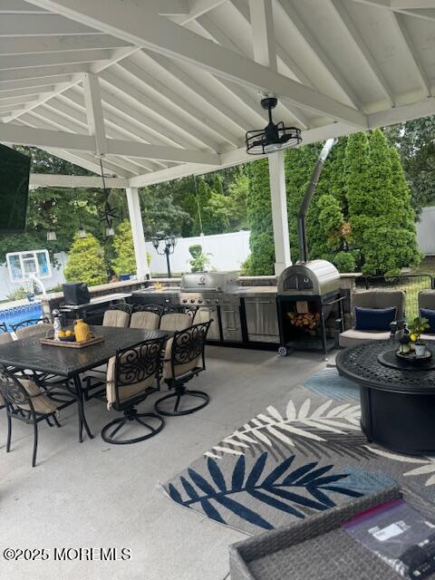 4 Coral Drive Howell, NJ 07731 - Photo 43 of 47 a view of a patio with lawn chairs next to a yard