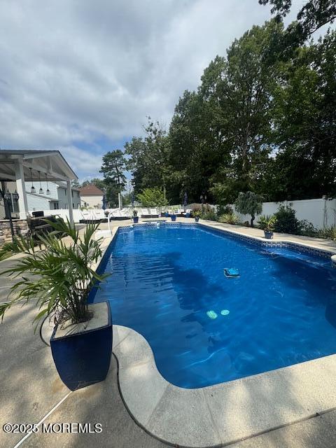 4 Coral Drive Howell, NJ 07731 - Photo 46 of 47 a view of a swimming pool with lounge chair