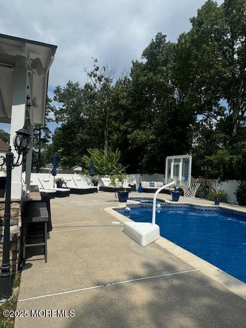 4 Coral Drive Howell, NJ 07731 - Photo 47 of 47 a view of a swimming pool with chairs