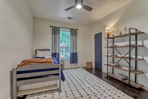 a bathroom with a double vanity sink a mirror a bathtub and shower