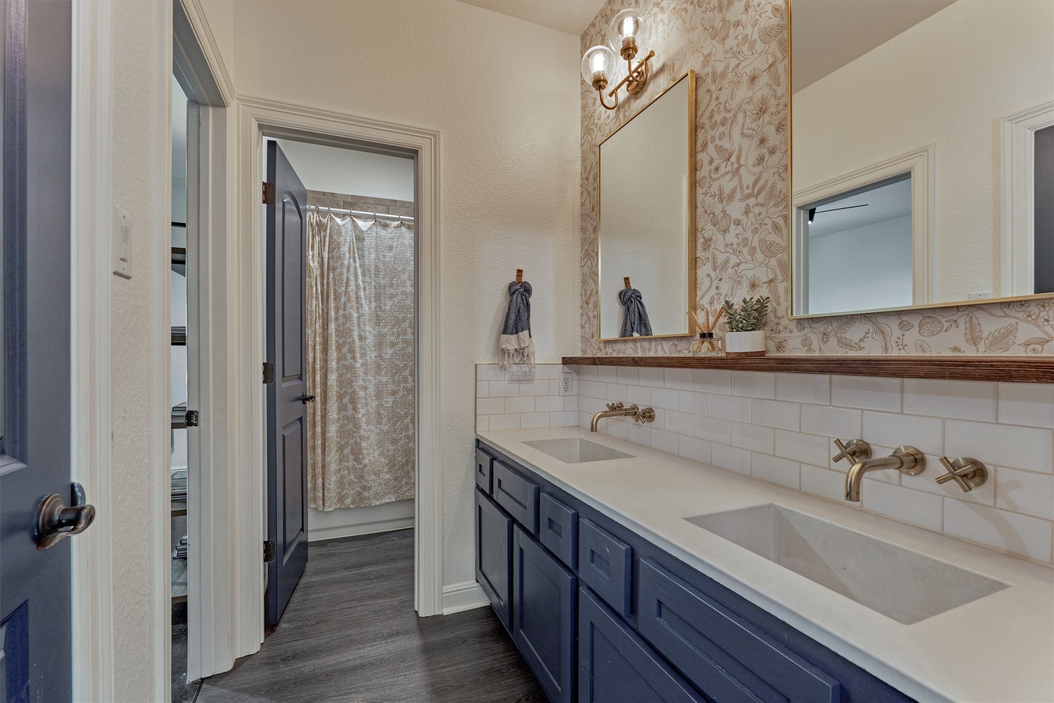 16727 Boothill Road Stagecoach, TX 77355 - Photo 26 of 44 Full secondary bathroom with dual vanities and elegant hardware.