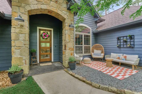 a front view of a house with outdoor seating