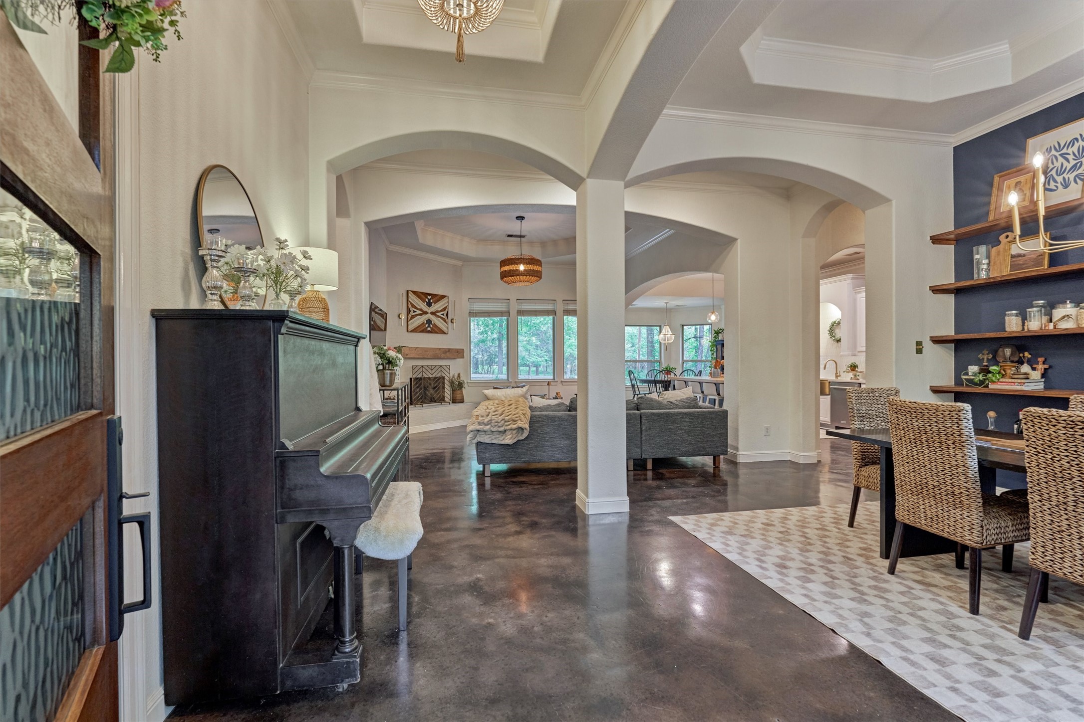 16727 Boothill Road Stagecoach, TX 77355 - Photo 4 of 44 Step inside to an absolutely stunning interior with continuous concrete floors throughout and serene sightlines into the living areas and windows overlooking the tranquil backyard.