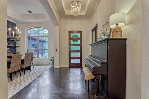 a view of an entryway with wooden floor