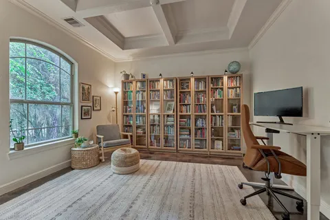 a view of a livingroom with furniture and a flat screen tv
