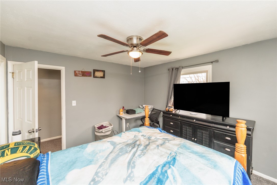 3443 Dentzler Road Parma, OH 44134 - Photo 16 of 48 Carpeted bedroom featuring baseboards and a ceiling fan