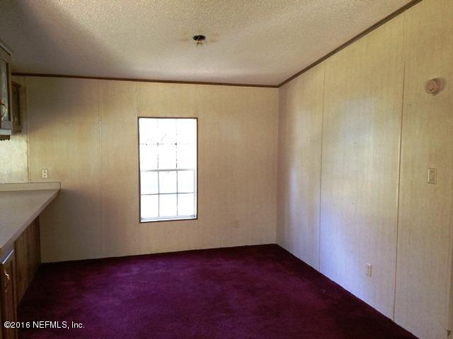 13126 Pate Road West Jacksonville, FL 32226 - Photo 5 of 14 a view of a big room with windows and closet
