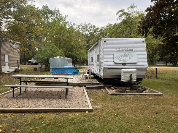 a view of a park with lounge chair