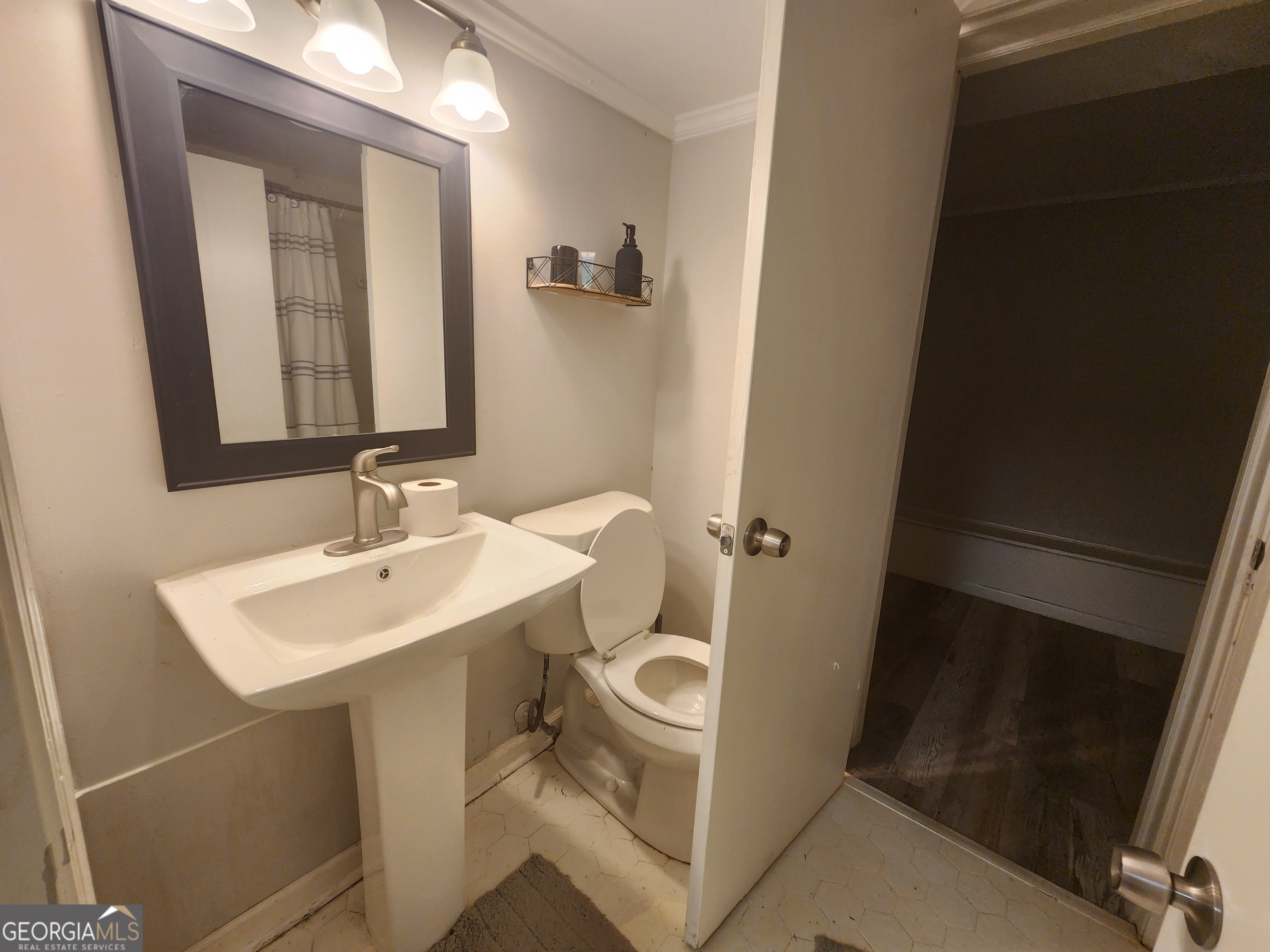 917 Oakview Avenue, Unit E Columbus, GA 31906 - Photo 11 of 13 a bathroom with a sink toilet and mirror