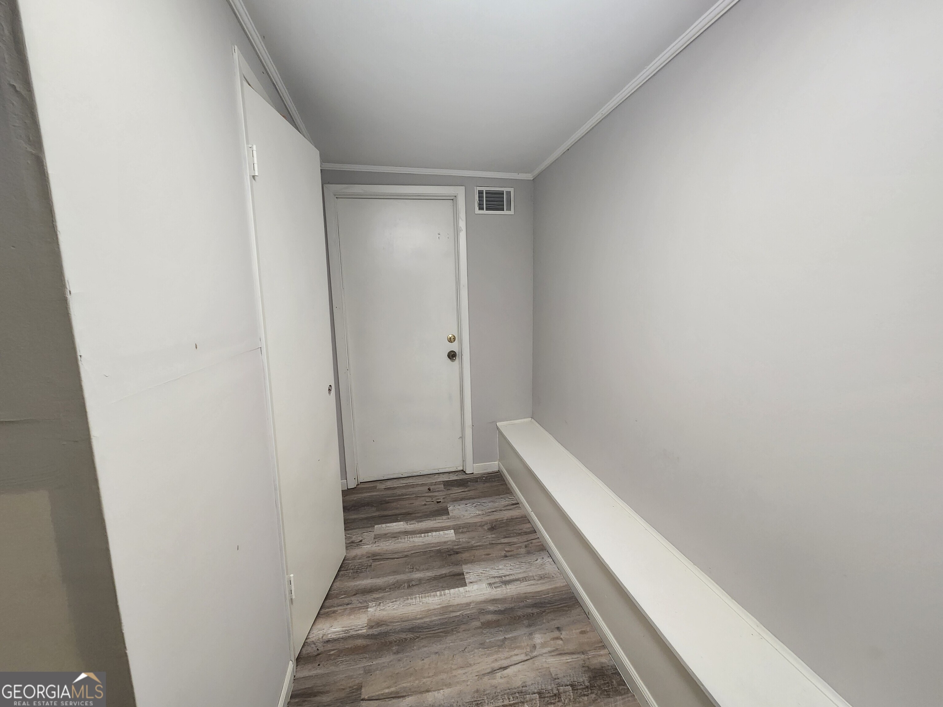 917 Oakview Avenue, Unit E Columbus, GA 31906 - Photo 13 of 13 a view of a hallway with wooden floor
