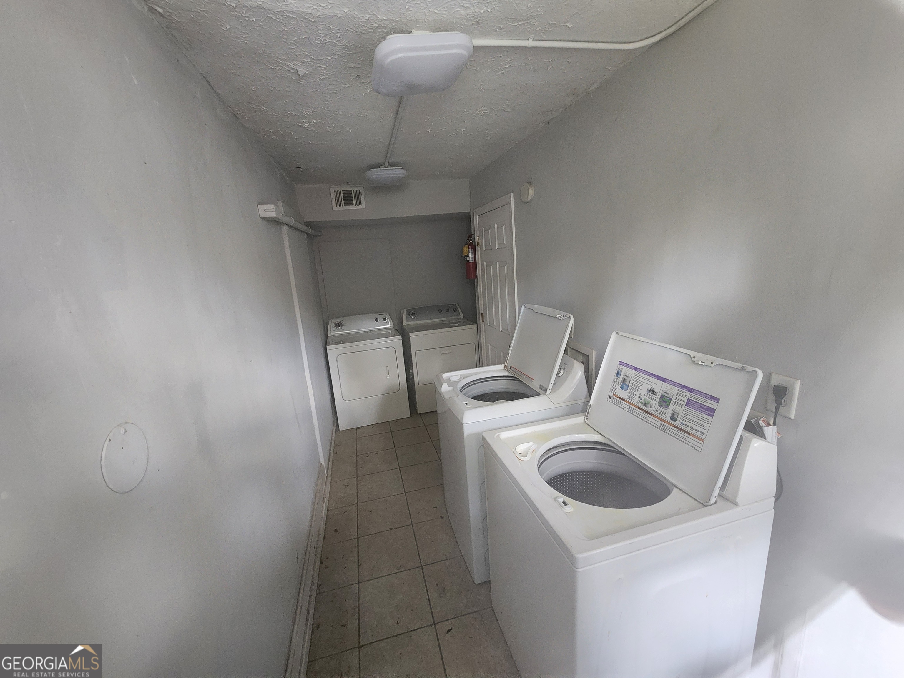 917 Oakview Avenue, Unit E Columbus, GA 31906 - Photo 2 of 13 a utility room with dryer and washer