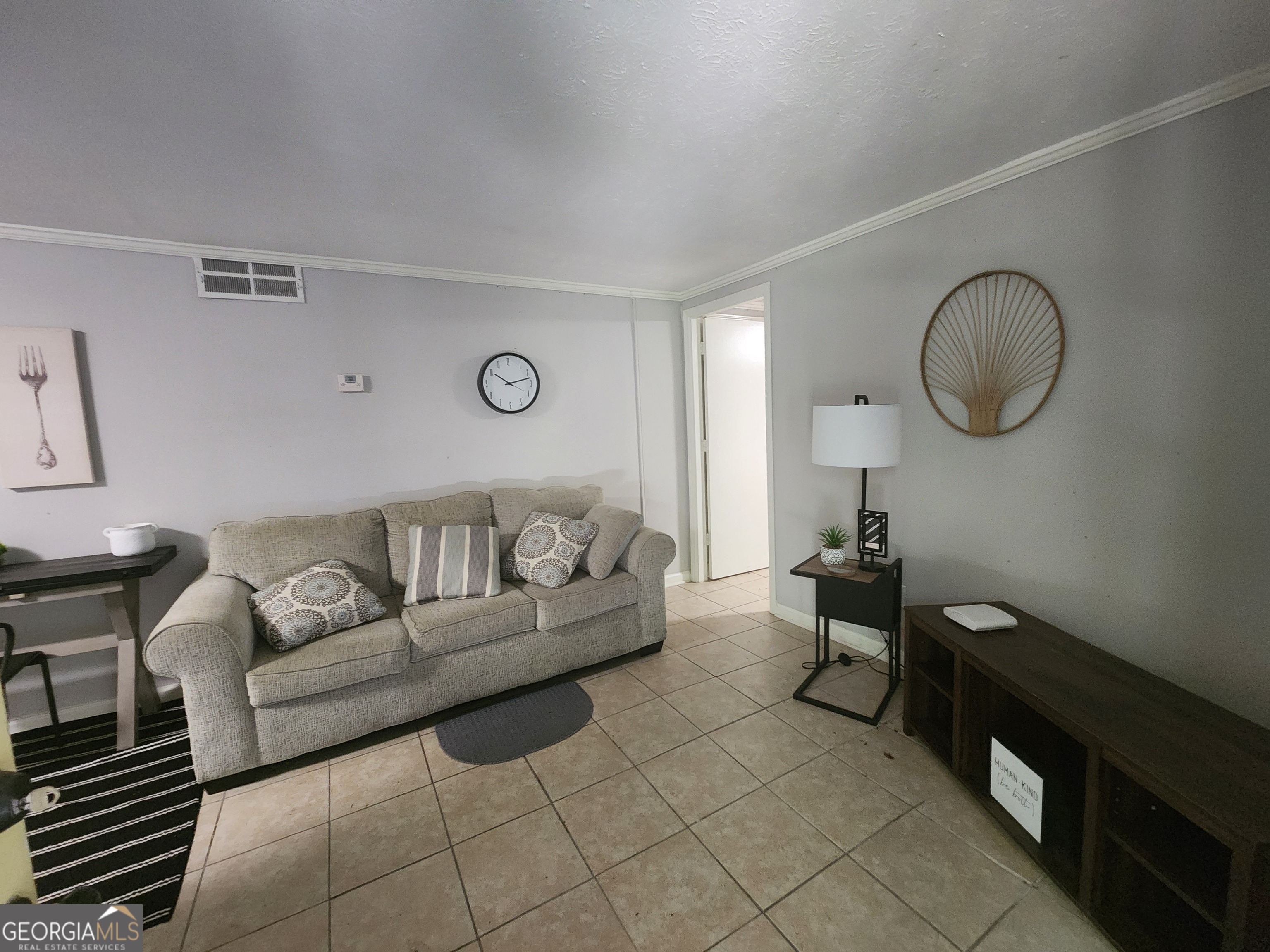 917 Oakview Avenue, Unit E Columbus, GA 31906 - Photo 9 of 13 a living room with furniture a couch and potted plant