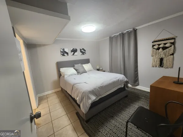 a bedroom with a bed and dresser
