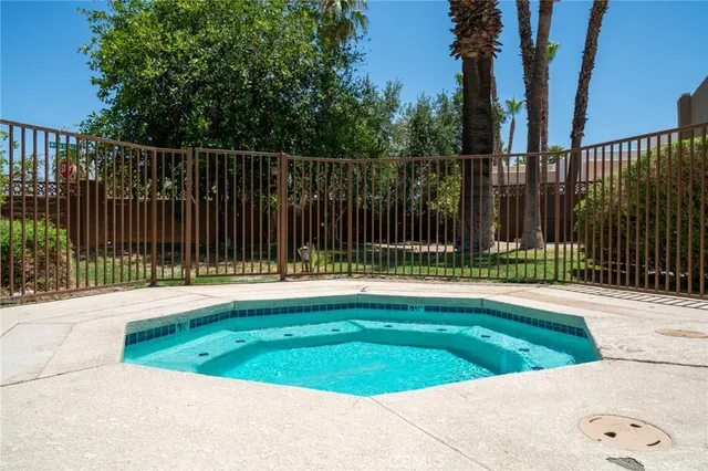a view of a backyard with a small pool