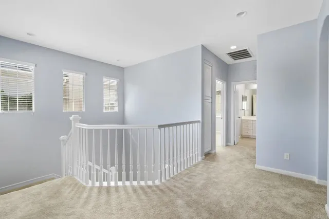 a view of a hallway with a livingroom