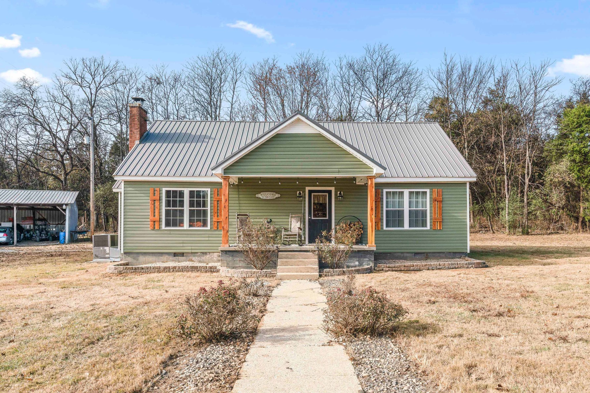 345 Wabash Road Mulberry, TN 37359 - Photo 1 of 63 a front view of a house with a yard and trees