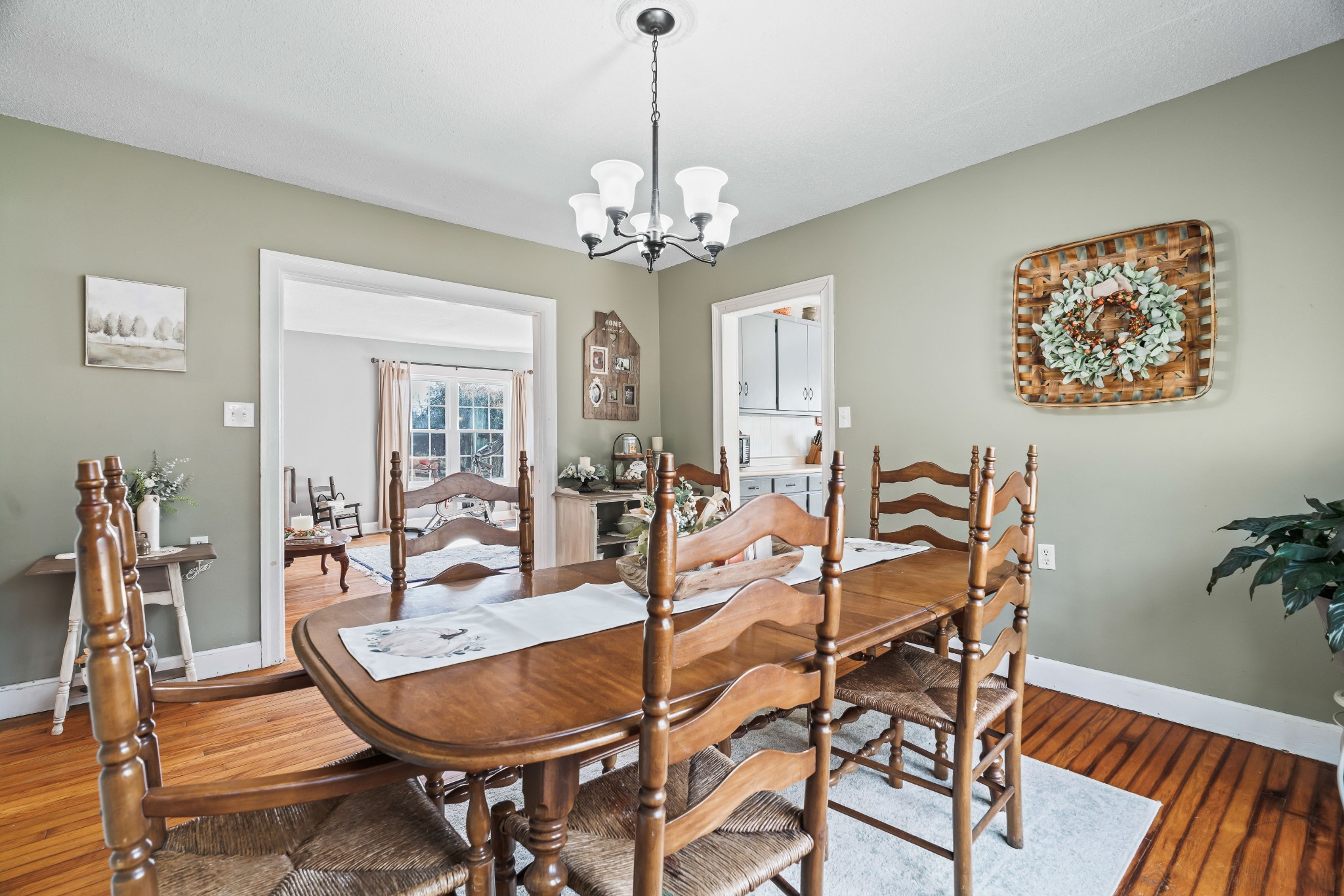 345 Wabash Road Mulberry, TN 37359 - Photo 15 of 63 a dining room with furniture a chandelier and wooden floor