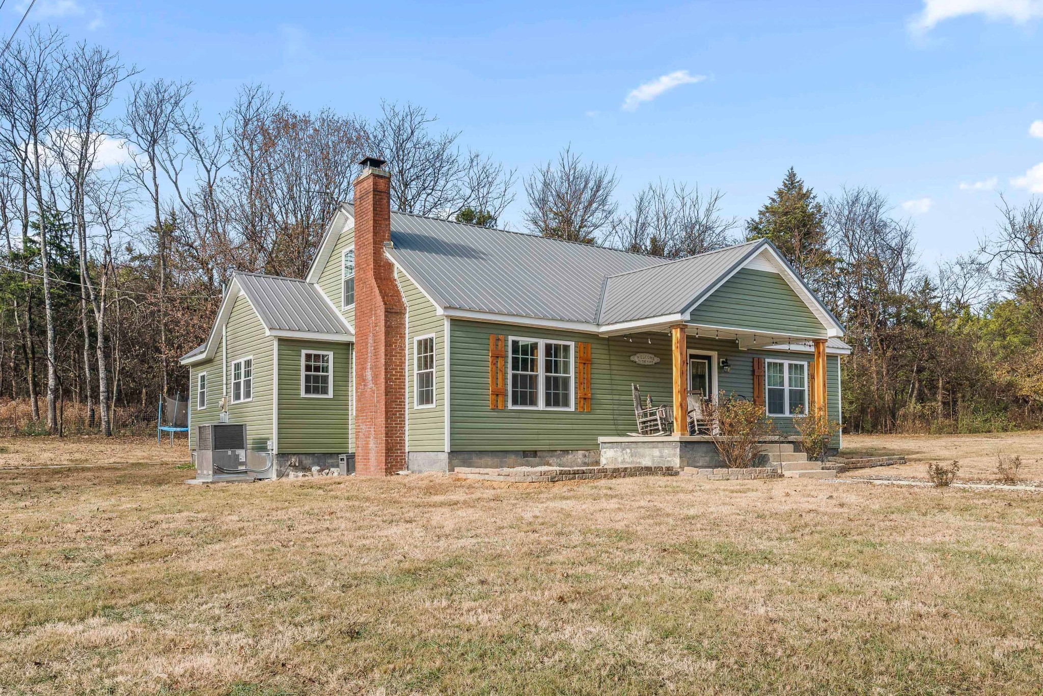 345 Wabash Road Mulberry, TN 37359 - Photo 2 of 63 a front view of house with yard and trees in the background
