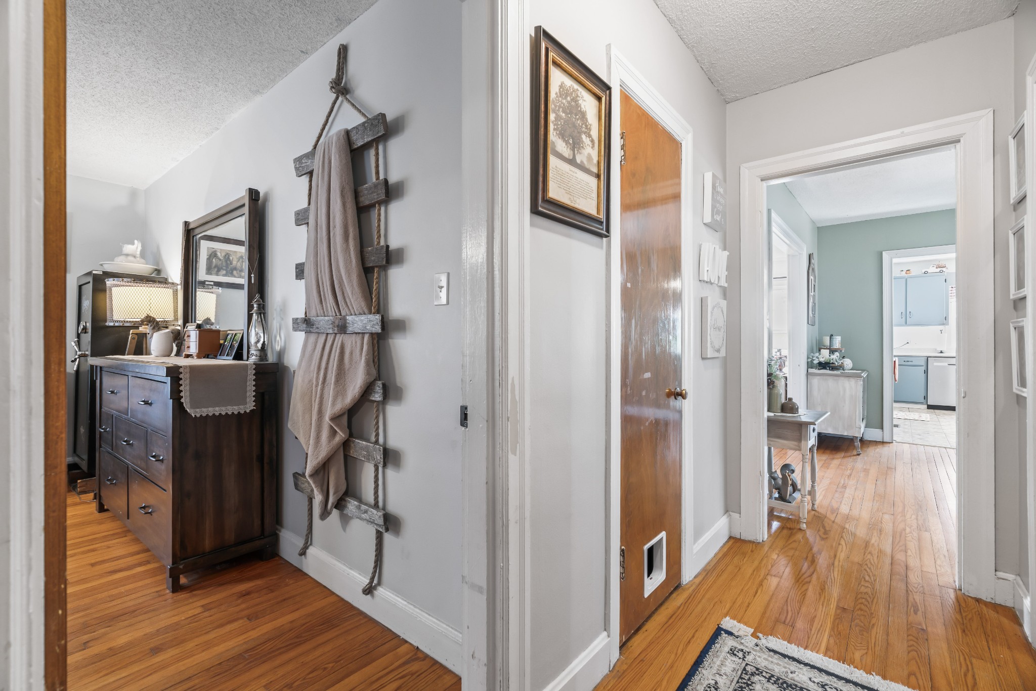345 Wabash Road Mulberry, TN 37359 - Photo 23 of 63 a view of a hallway with wooden floor and a living room