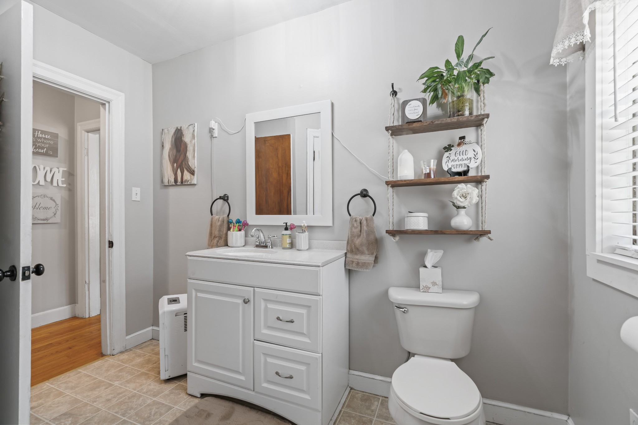 345 Wabash Road Mulberry, TN 37359 - Photo 30 of 63 a bathroom with a toilet a sink and mirror