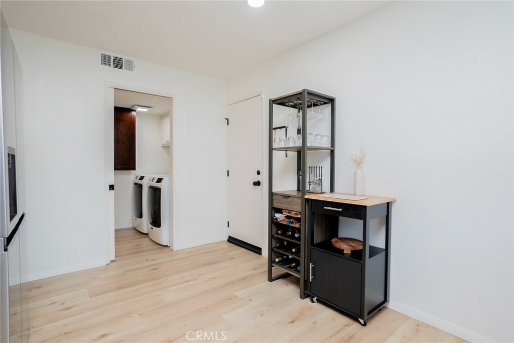 8025 70th Street Paramount, CA 90723 - Photo 12 of 31 wooden floor and closet in a room