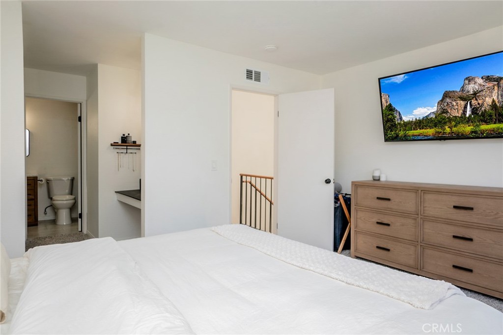 8025 70th Street Paramount, CA 90723 - Photo 18 of 31 a bedroom with a bed and a dresser