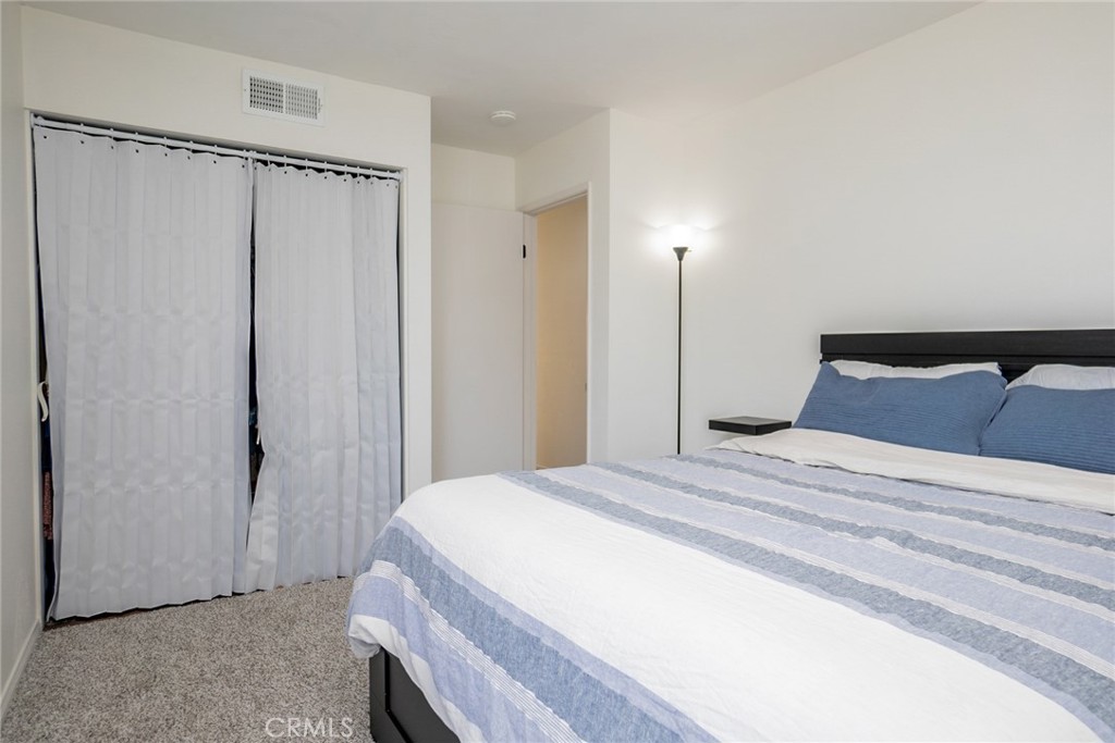 8025 70th Street Paramount, CA 90723 - Photo 24 of 31 a bedroom with a bed and a shower