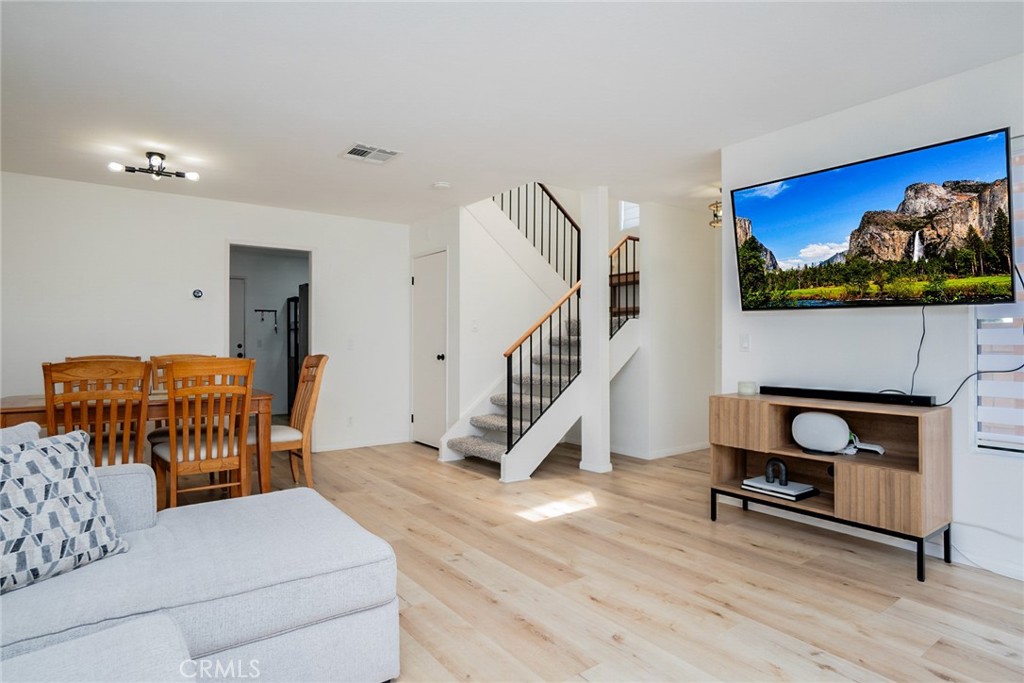 8025 70th Street Paramount, CA 90723 - Photo 4 of 31 a living room with furniture and a fireplace