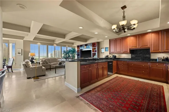 a kitchen with kitchen island granite countertop stainless steel appliances lots of counter top space