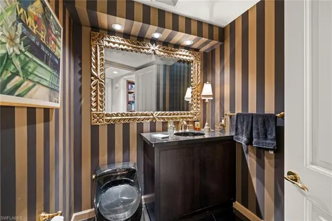 a bathroom with a mirror and a sink