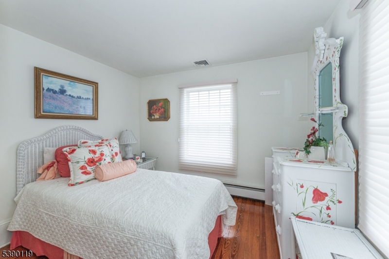 107 Clove Road, Unit 3 Wantage, NJ 07461 - Photo 22 of 45 a bedroom with a bed and a window