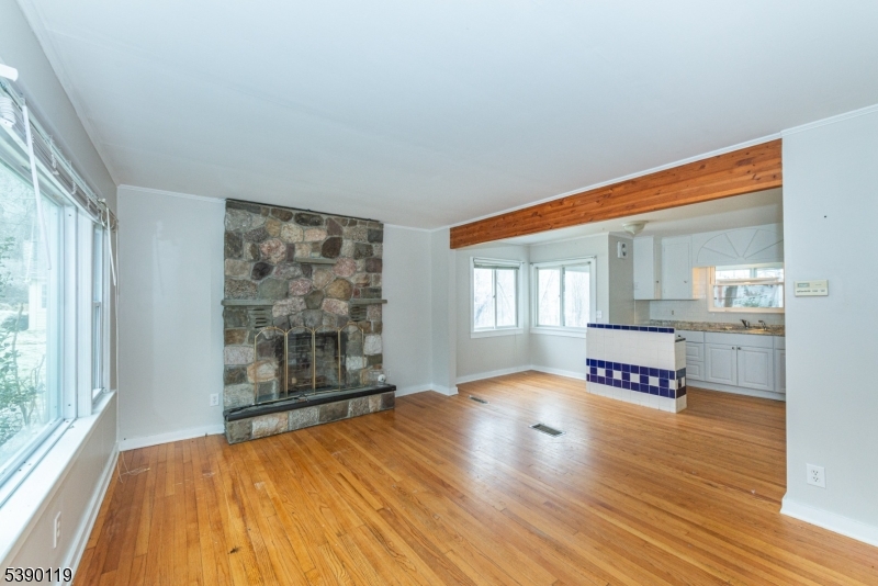 107 Clove Road, Unit 3 Wantage, NJ 07461 - Photo 26 of 45 wooden floor in an empty room with a window