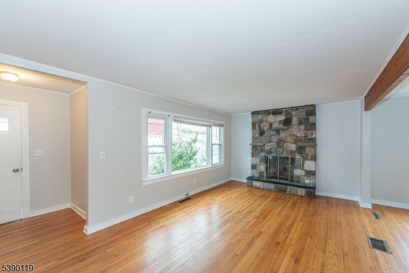 107 Clove Road, Unit 3 Wantage, NJ 07461 - Photo 27 of 45 an empty room with wooden floor and windows