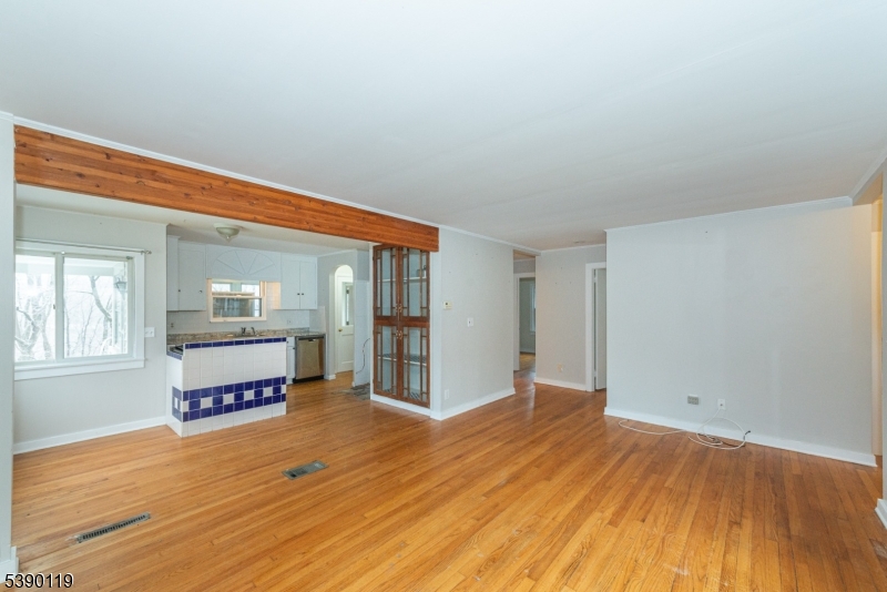 107 Clove Road, Unit 3 Wantage, NJ 07461 - Photo 28 of 45 an empty room with wooden floor and windows