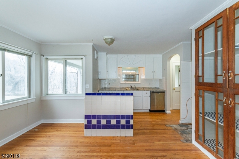 107 Clove Road, Unit 3 Wantage, NJ 07461 - Photo 29 of 45 a kitchen with stainless steel appliances granite countertop a refrigerator sink and cabinets