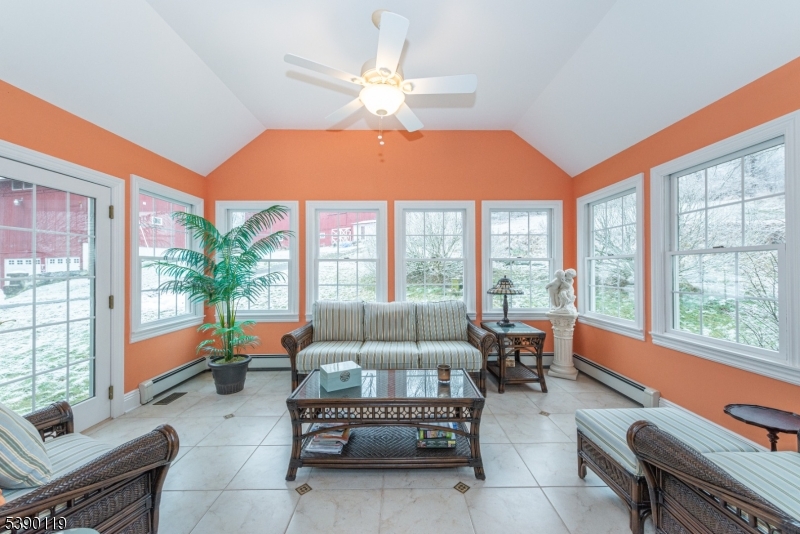 107 Clove Road, Unit 3 Wantage, NJ 07461 - Photo 3 of 45 a living room with furniture and a large window