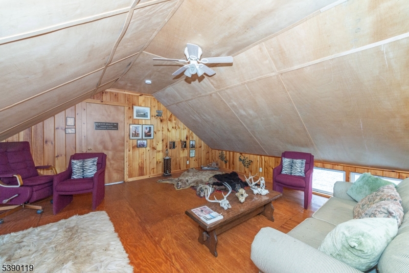 107 Clove Road, Unit 3 Wantage, NJ 07461 - Photo 42 of 45 a living room with furniture and a chandelier