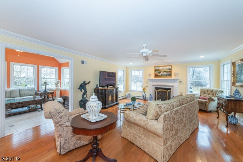 107 Clove Road, Unit 3 Wantage, NJ 07461 - Photo 5 of 45 a living room with fireplace furniture and a large window