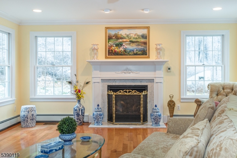 107 Clove Road, Unit 3 Wantage, NJ 07461 - Photo 6 of 45 a living room with furniture and a fireplace