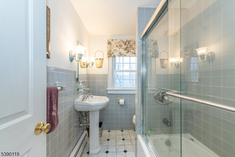 107 Clove Road, Unit 3 Wantage, NJ 07461 - Photo 9 of 45 a bathroom with a sink mirror and shower