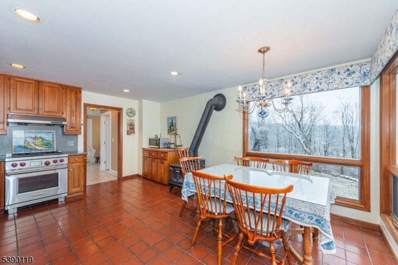 107 Clove Road, Unit 3 Wantage, NJ 07461 - Photo 10 of 45 a view of a dining room with furniture window and wooden floor