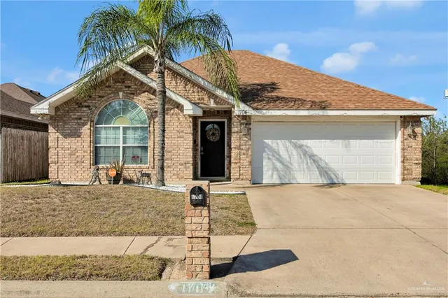 a front view of a house with garage