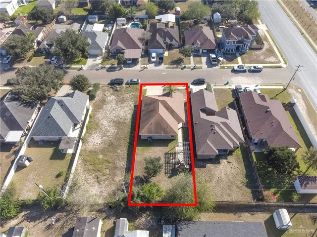 an aerial view of residential houses and outdoor space