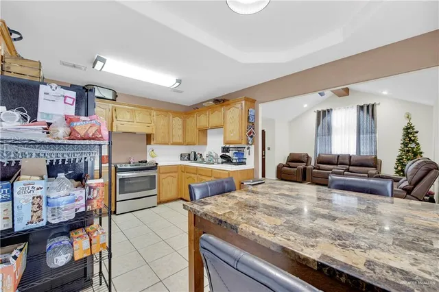 a large kitchen with granite countertop lots of counter top space