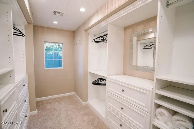 a bathroom with a bathtub a sink and mirror
