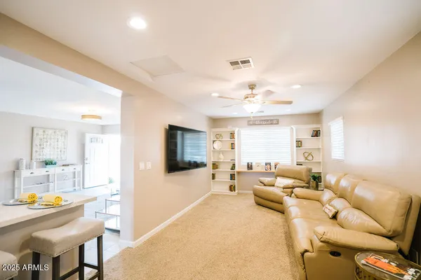 a living room with furniture and a large window