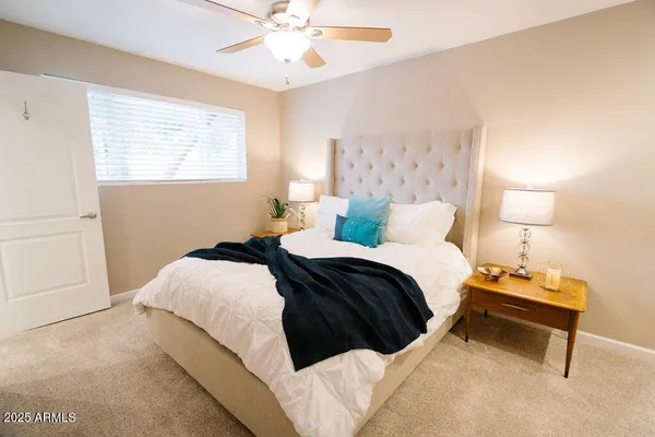 a bedroom with a bed and window