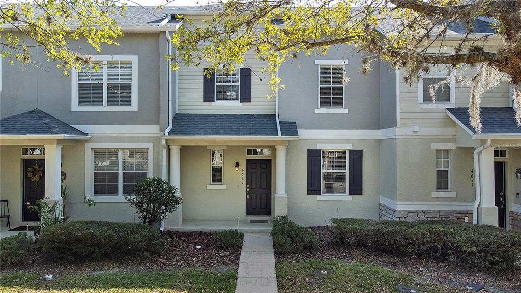 a front view of a house with garden