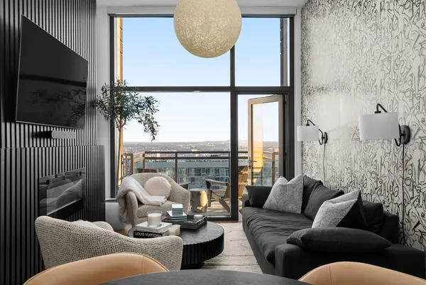 a living room with furniture fireplace and a flat tv screen